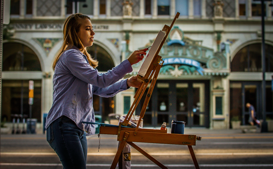 image of artist painting during Urban Plein Air